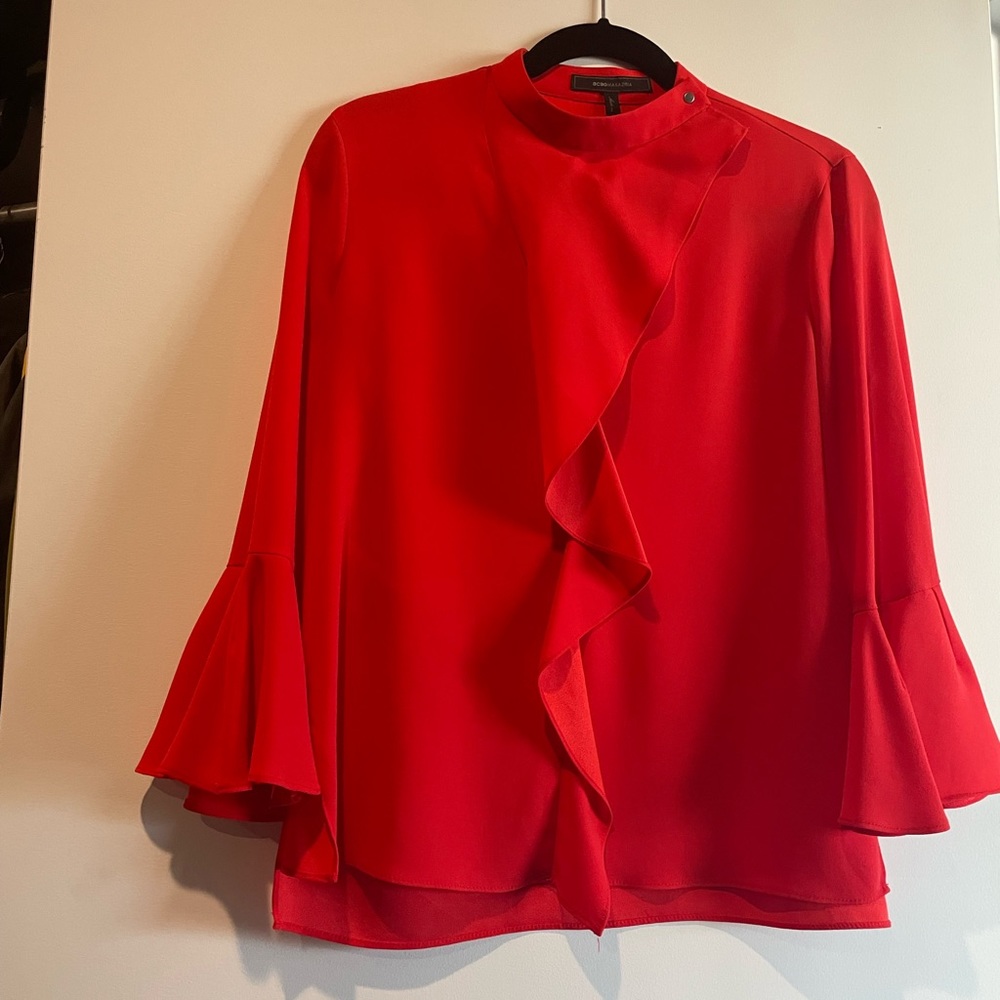 Red blouse with flared sleeves